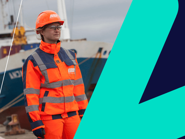 Female freight worker in front of ship